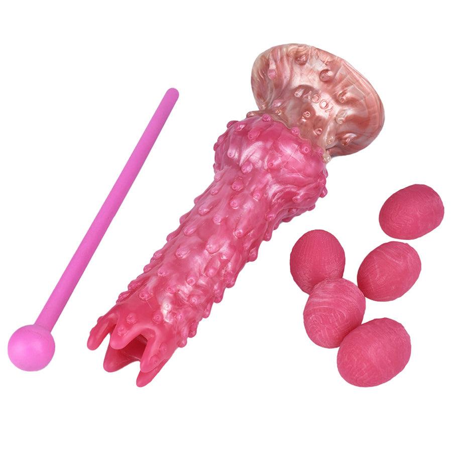 Pinker Alien-Dildo mit manuellem Ovulationsgerät